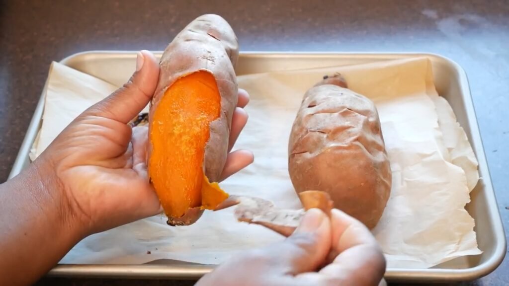 Homemade Sweet Potato Pie Recipe Peeling baked sweet potatoes