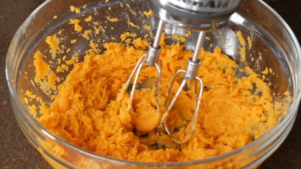 Homemade Sweet Potato Pie Recipe blending sweet potatoes to get a smooth texture