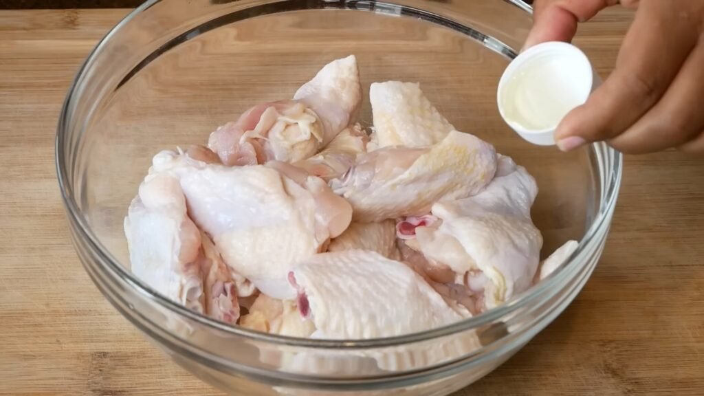 Adding oil to wings before seasoning