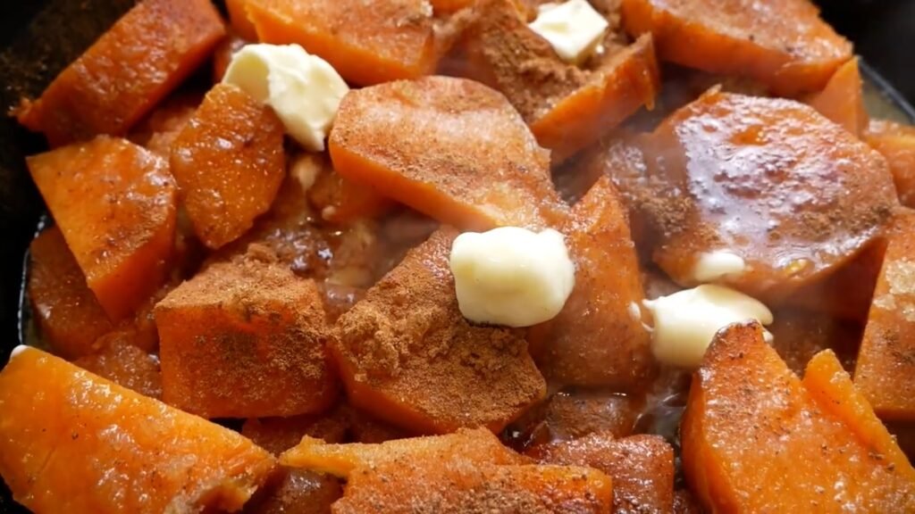 Southern Candied Yams Cooking sweet potatoes in the sugar glaze
