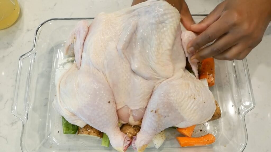 Lifting the skin of the chicken