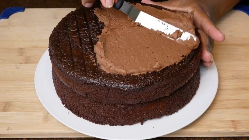 Easy Homemade Chocolate Cake Icing the cake