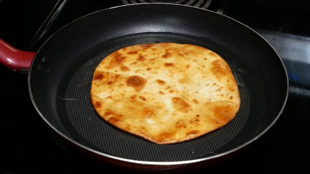 Homemade Mexican Pizza Recipe (Better Than Taco Bell!) Golden brown flour tortillas fried until crispy for homemade Mexican pizza.