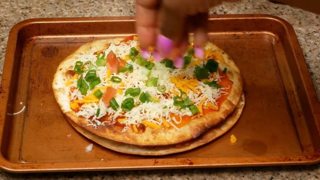 Homemade Mexican Pizza Recipe (Better Than Taco Bell!) Green onions spread on top before baking