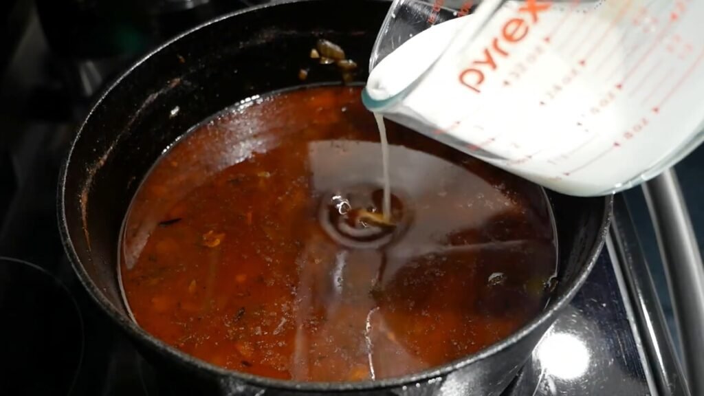 Adding slurry to make the gravy