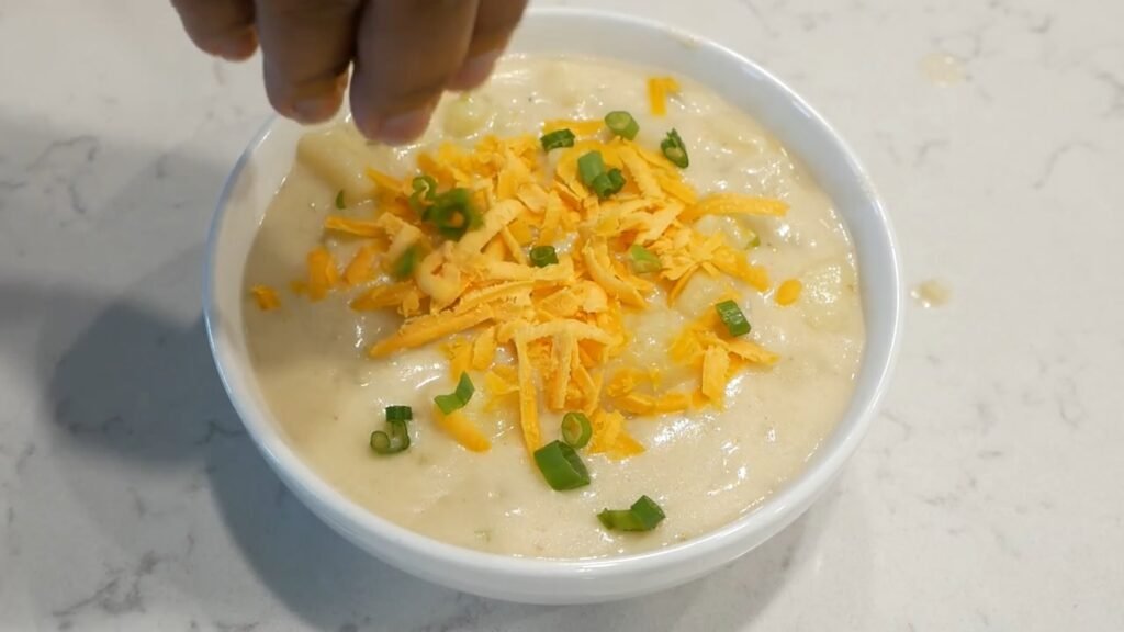 Creamy Potato Soup Recipe Adding topping to the soup