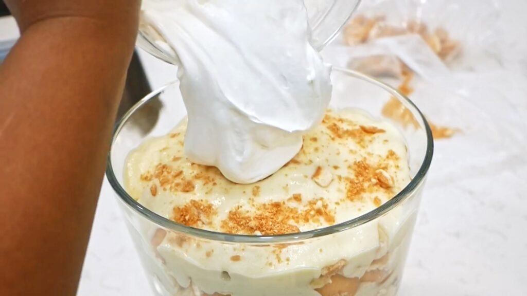 Homemade Banana Pudding Adding the whipped topping to the homemade banana pudding